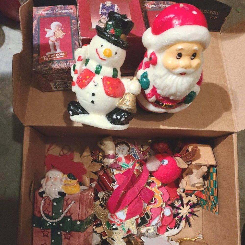 Shoebox full of ornaments and Christmas items, candles, displays
